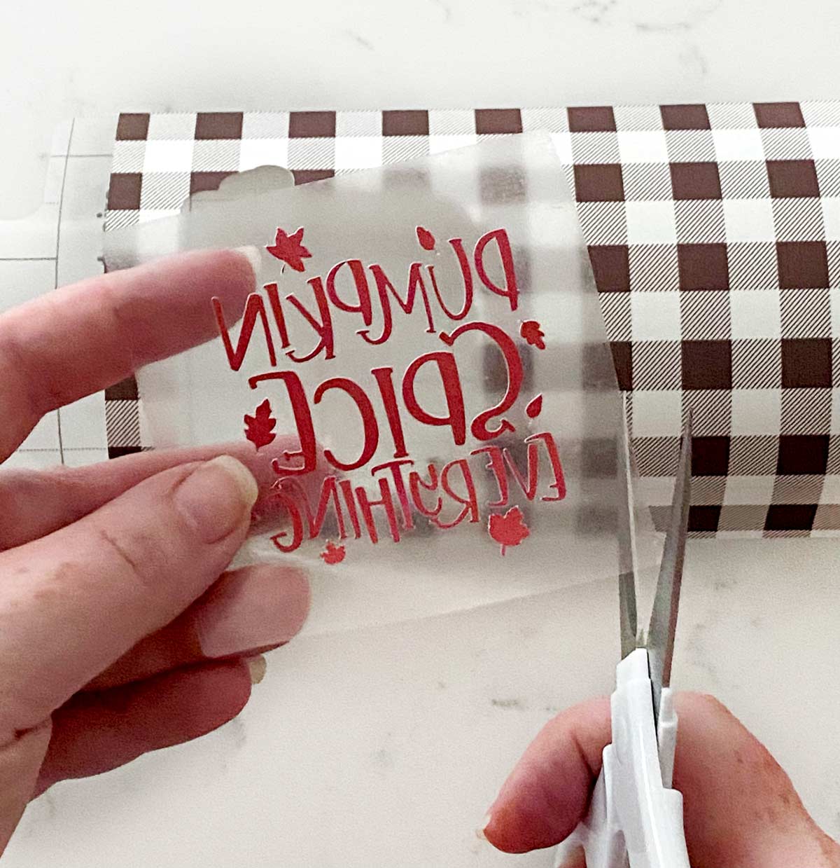 Cutting infusible ink on a white counter. 