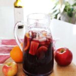 A pitcher of sangria on a kitchen counter.