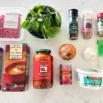 Lasagna Soup Ingredients on a marble kitchen countertop.