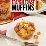 Single Apple French Toast Muffin With Fork On White Plate On Top Of Kitchen Counter.