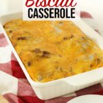 Sausage egg biscuit casserole in white casserole dish on top of kitchen counter.